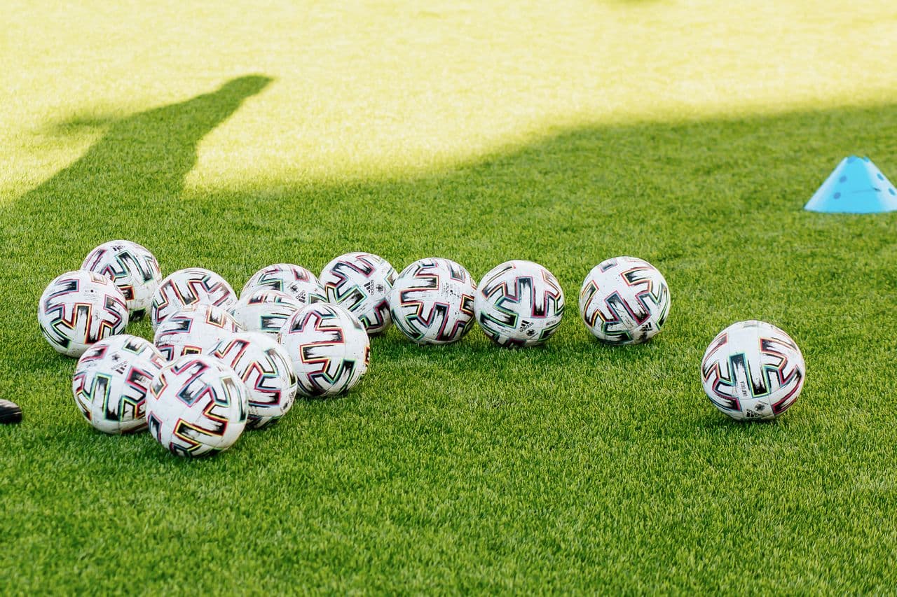 Match balls left out on a training pitch